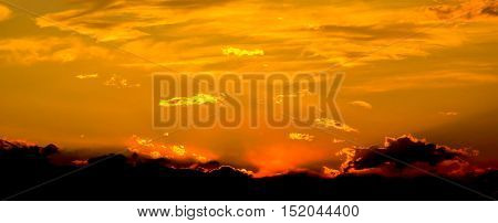 Beautiful sunset with clouds and sun rays.