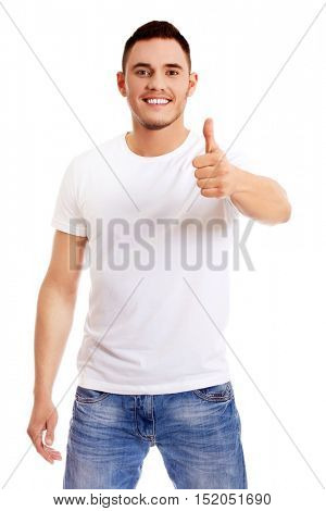 Happy young man  showing thumb up