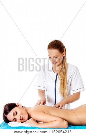 Woman having massage of body in the spa salon. Beauty treatment concept.