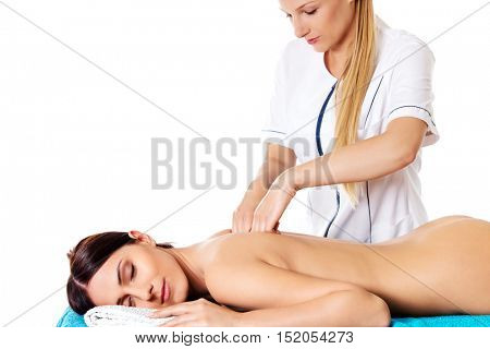 Woman having massage of body in the spa salon. Beauty treatment concept.