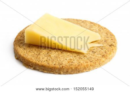 Single Scottish Oatcake With A Slice Of Yellow Cheese Isolated On White.
