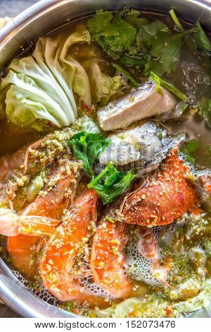 Seafood spicy hot pot crab prawn fish squid tumyum