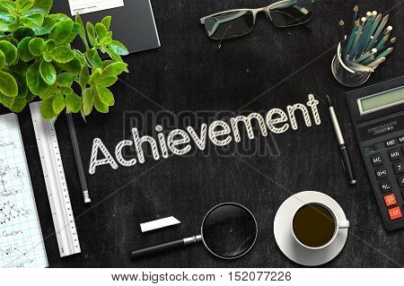 Top View of Office Desk with Stationery and Black Chalkboard with Business Concept - Achievement. 3d Rendering. Toned Image.