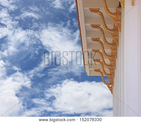 roof of the Thailand Buddhist temple on blue sky background.