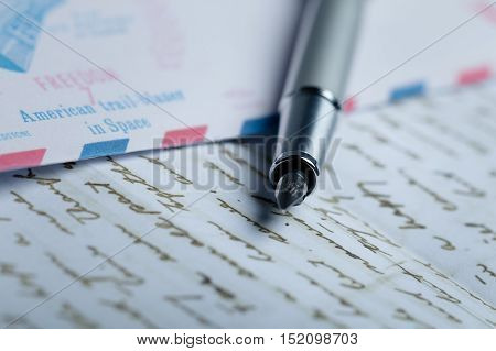 Parker Fountain Pen Lying on the Letter and Envelope - Close Up