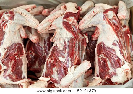 Raw meat, skin duck carcass in box. selected focus.