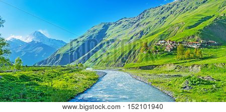The picturesque mountain Snostskali river runs along the villages and pastures of the Sno gorge and flowing into Terek Kazbegi Georgia.