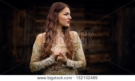 Thoughtful young woman looking for someone. Fantasy fashion idea. Long Time Coming.