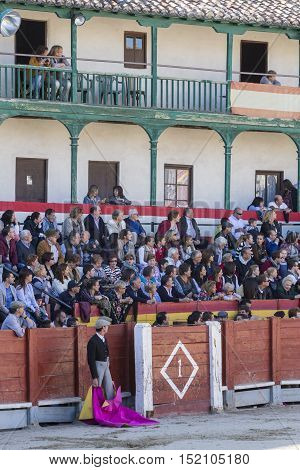 Chinchon Spain - October 15 2016: Traditional bullfighting stamp in the main square of chinchon during the festival charity Chinchon Madrid province Spain