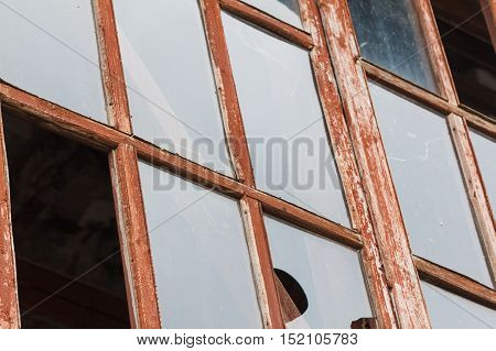 broken glass window ruins in an abandoned old house