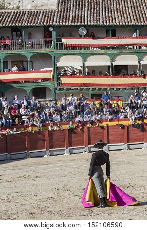 Chinchon SPAIN - October 15 2016: Spainish bullfighter Miguel Abellan with the cape in the main square of chinchon during the festival benefit traditional Chinchon Madrid province Spain