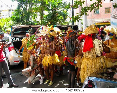 Point-a-Pitre, Guadeloupe - February 09, 2013: Beautiful black girls making a photo and preparing at the Caribbean Carnival at Point-a-Pitre, Guadeloupe