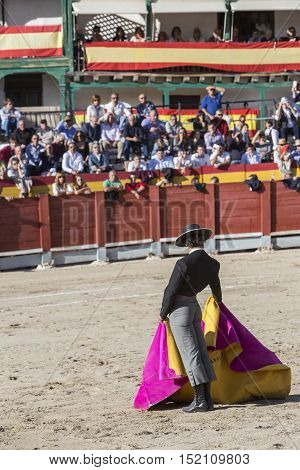 Chinchon SPAIN - October 15 2016: Spainish bullfighter Miguel Abellan with the cape in the main square of chinchon during the festival benefit traditional Chinchon Madrid province Spain