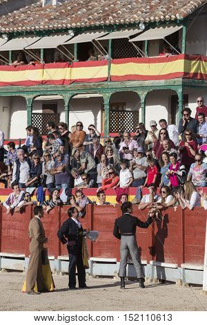 Chinchon Spain - October 15 2016: Traditional bullfighting stamp in the main square of chinchon during the festival charity Chinchon Madrid province Spain