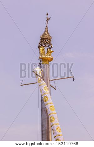 Phuket Thailand - April 25 2016 : Post with chicken on top at at Koh (islands) Sirey temple Phuket Thailand. It was built by Myanmar Buddhists who work in this region