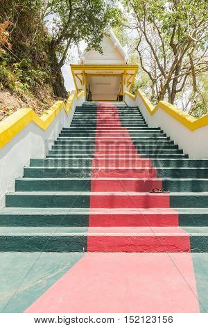 Phuket Thailand - April 25 2016 : The main stair leading to the replica of Phra That In-Kwaen (Hanging Golden Rock) at Sirey temple Phuket Thailand.