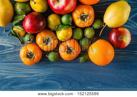 fruitage pile on wooden table. Top view