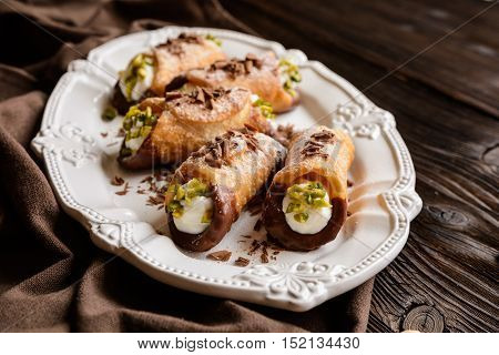 Traditional Sicilian Cannoli Stuffed With Ricotta And Pistachios