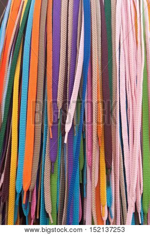 Collection of many colorful shoelaces at a retail stand