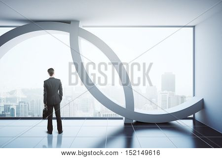 Back view of businessman in modern interior with city view and daylight. 3D Rendering