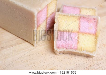 Freshly Cut Battenberg Cake With Pink And Yellow Sponge Covered In Marzipan