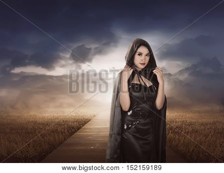 Beautiful Asian Witch Woman With Black Hood