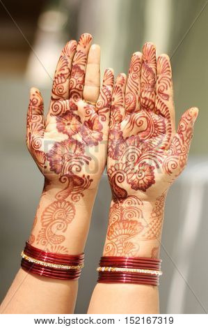 Show off two Hands Decorated with Mehandi on Women Hand