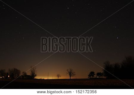 The sky at night above a farm
