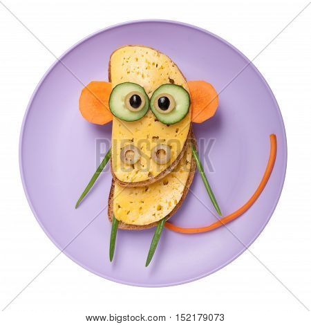 Confused monkey made of bread and vegetables on plate
