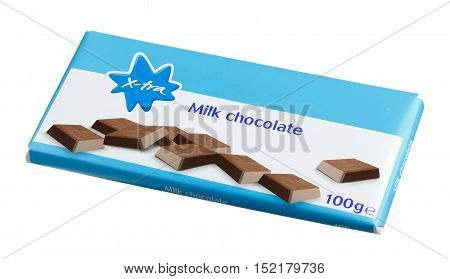 Stockholm, Sweden - March 2, 2014: A package with a bar of 100 g Coop X-tra milk chocolate isolated on white background.