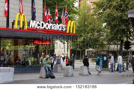 Trondheim, Norway - August 31, 2013: The exterior of the shopping mall Trondheim Torg in city center with hamburger resturant McDonald's.