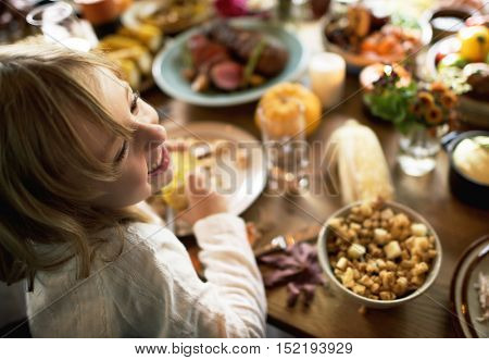 Little Kid Children Eating Corn Thanksgiving Celebration Concept