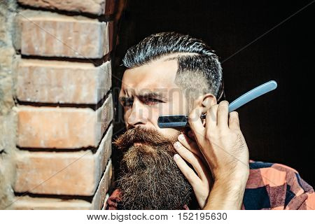 Hipster Cutting With Razor