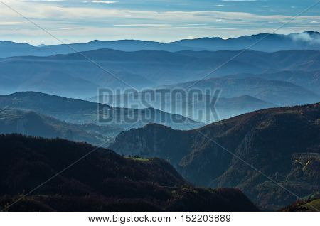 Aerial view of rolling hills and mountains at autumn sunny day, view from Bobija mountain, Serbia