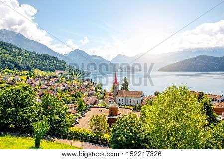 Landscape view on Weggis village on Lucerne lake with beautiful mountains on the background in Switzerland