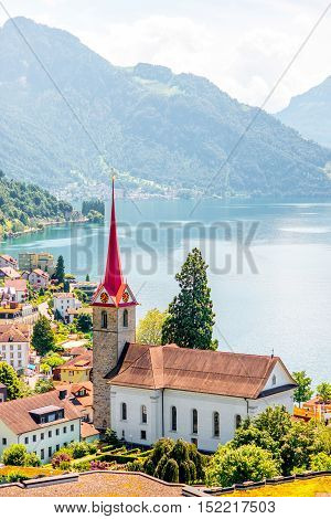 Landscape view on Weggis village with beautiful church on Lucerne lake in Switzerland