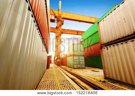 Port of containers and cranes dock dusk landscape.