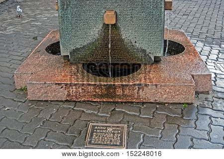 TIMISOARA ROMANIA - NOVEMBER 2 2012:Fountain memorial monument in honor of the heroes who died in the December 1989 at anticommunist revolution in Timisoara. The names of the deceased are inscribed