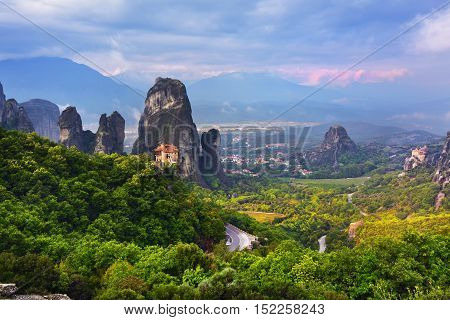 Meteora monasteries. Beautiful landscape and view on the Holy Monastery of Roussanov placed on the edge of high rock before sunset. Kastraki Greece