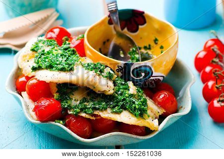 Lazy Fish.fried tilapia fillet with tomato.seletive focus