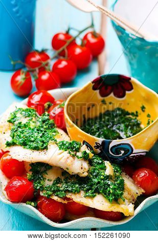 Lazy Fish.fried tilapia fillet with tomato.seletive focus
