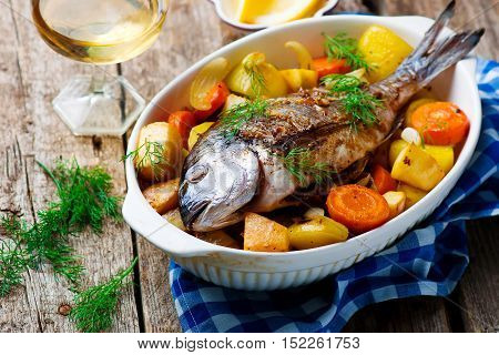 Oven Baked Fish and Vegetables. seletive focus