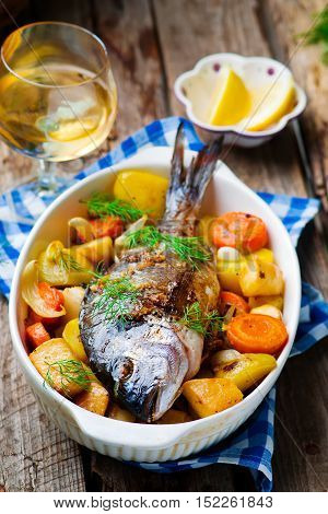 Oven Baked Fish and Vegetables. seletive focus
