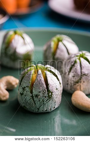 Indian sweets in artistic shape and form covered with silver foil (mithai)