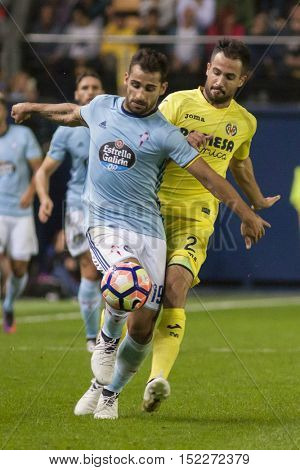 VILLARREAL, SPAIN - OCTOBER 16th: Jonny with ball and Mario during La Liga soccer match between Villarreal CF and R.C. Celta de Vigo at El Madrigal Stadium on October 16, 2016 in Villarreal, Spain