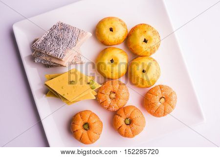 almond, pista, mango and orange flavoured pedha and burfi Indian sweet dish made from milk , dry fruits and fruits, diwali food