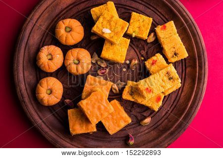almond, pista, mango and orange flavoured pedha and burfi Indian sweet dish made from milk , dry fruits and fruits, diwali food