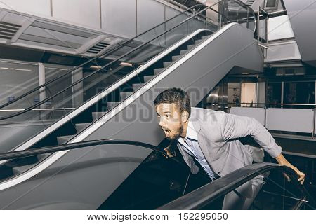 Frightened Man Run Away. Stressed Businessman. Scared Man.