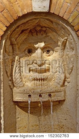 A detail of a spring water fountain in Rome Italy
