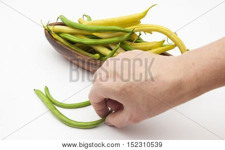 Harvest of asparagus siliculose yellow and green beans. Isolated on white  